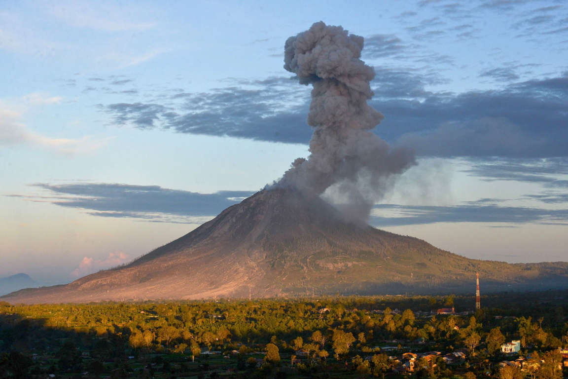 Slide 13 of 33: Mount Sinabung eruption, North Sumatra, Indonesia - 15 Jun 2017 Mount Sinabung spewing out volcanic ash in Gundaling village