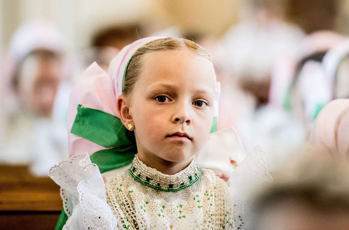 Slide 32 of 33: Corpus Christi Procession of the Sorbs, Crostwitz, Germany - 15 Jun 2017 An Sorbs girl in her traditional costume attends a holy mass during a Corpus Christi procession in Crostwitz, Germany, 15 June 2017. The procession has been a tradition in Lusatia r