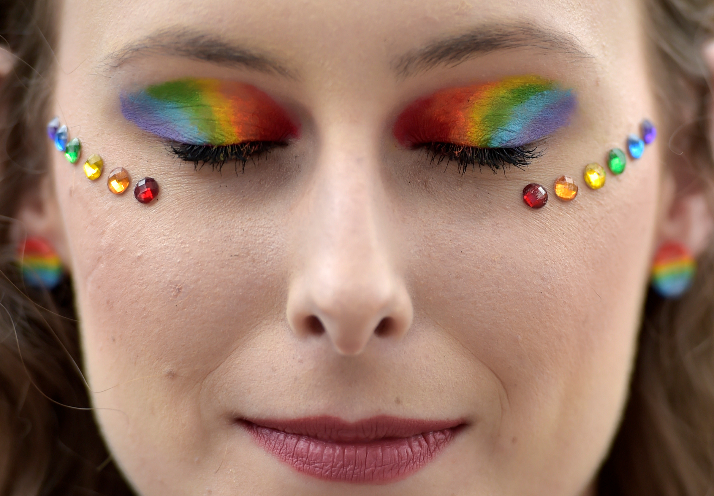 Slide 38 of 57: A participant with her eyes rainbow colors maked up takes part at the annual Belgian LGBT Pride Parade in central Brussels, Belgium May 20, 2017. REUTERS/Eric Vidal TPX IMAGES OF THE