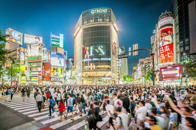 Slide 32 of 32: People walking across the Shibuya crossing in Tokyo, Japan.