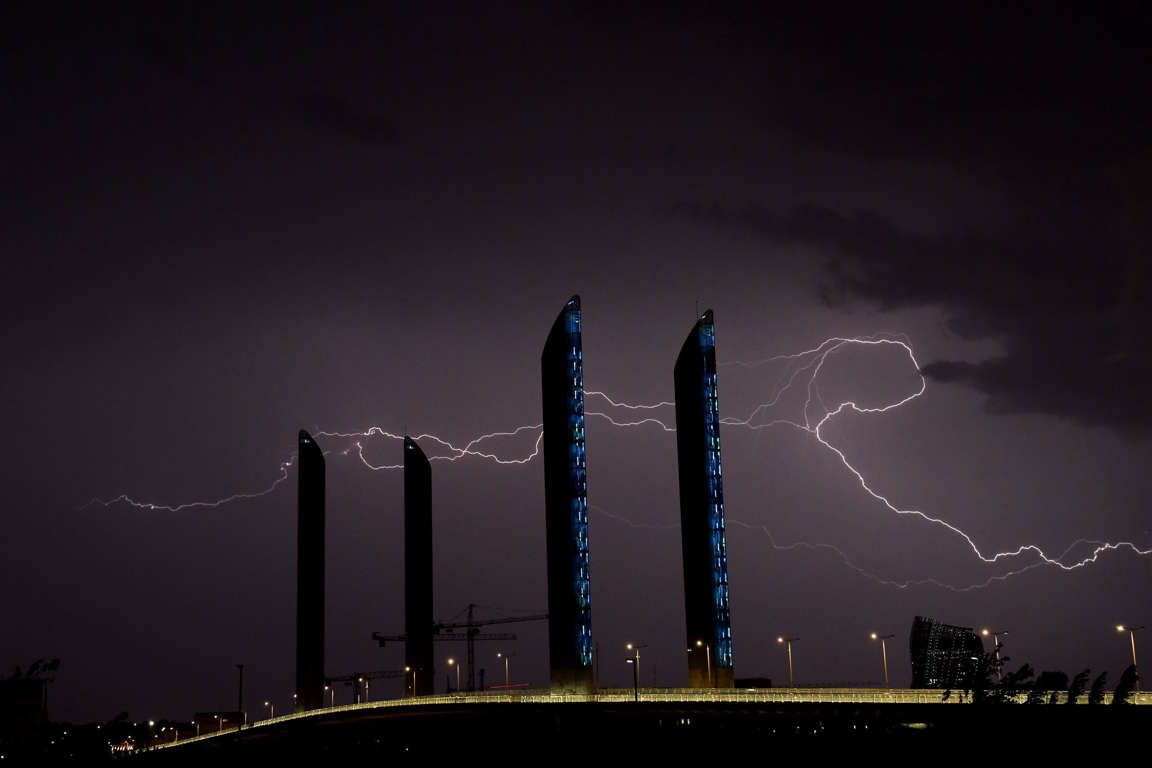 Slide 4 of 40: A lightning flashes above Bordeaux and the Chaban-Delmas bridge in southwestern France during a storm on June 8, 2017.