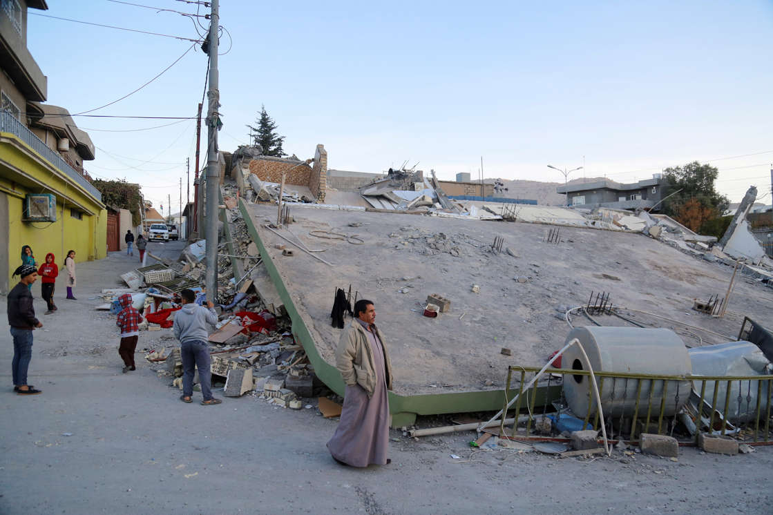 Slide 3 of 10: SULAYMANIYAH, IRAQ - NOVEMBER 13: A collapsed house is seen, after a 7.3 magnitude earthquake hit northern Iraq, in Derbendihan district of Sulaymaniyah, Iraq on November 13, 2017. An earthquake measuring 7.3 on the Richter scale rocked northern Iraq and Iran, the U.S. Geological Survey said on Sunday evening. At least 61 people were killed and more than 300 others injured in Iran's border areas, according to information provided by the concerned authorities, said Iran's semi-official Fars News Agency. (Photo by Yunus Keles/Anadolu Agency/Getty Images)