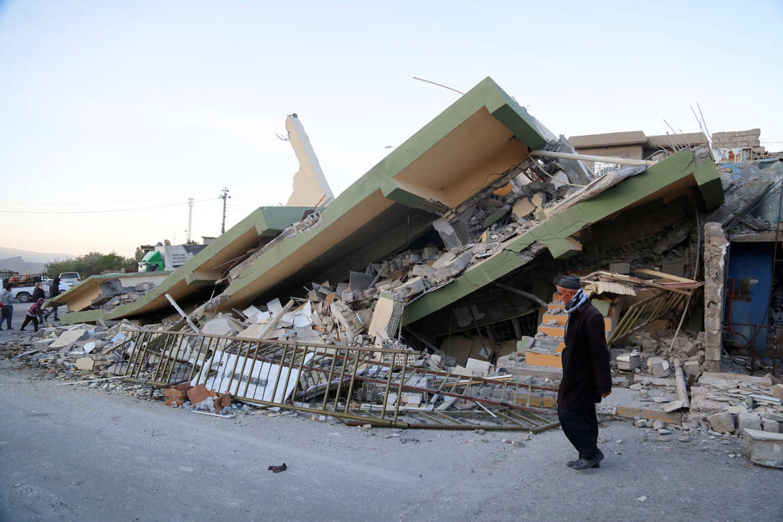 Slide 1 of 10: SULAYMANIYAH, IRAQ - NOVEMBER 13: A collapsed house is seen, after a 7.3 magnitude earthquake hit northern Iraq, in Derbendihan district of Sulaymaniyah, Iraq on November 13, 2017. An earthquake measuring 7.3 on the Richter scale rocked northern Iraq and Iran, the U.S. Geological Survey said on Sunday evening. At least 61 people were killed and more than 300 others injured in Iran's border areas, according to information provided by the concerned authorities, said Iran's semi-official Fars News Agency. (Photo by Yunus Keles/Anadolu Agency/Getty Images)