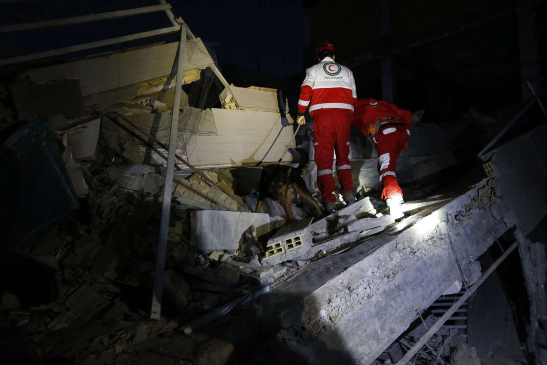 Slide 4 of 10: Rescue personnel conduct search and rescue work following a 7.3-magnitude earthquake at Sarpol-e Zahab in Iran's Kermanshah province on November 13, 2017. At least 164 people were killed and 1,600 more injured when a 7.3-magnitude earthquake shook the mountainous Iran-Iraq border triggering landslides that were hindering rescue efforts, officials said.  / AFP PHOTO / ISNA / POURIA PAKIZEH        (Photo credit should read POURIA PAKIZEH/AFP/Getty Images)