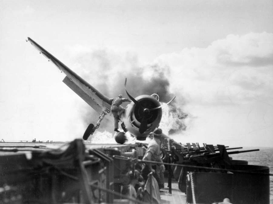 Slide 40 de 100: F6F Hellcat (VF-2) crash landed on USS Enterprise's flight deck. World War Two.