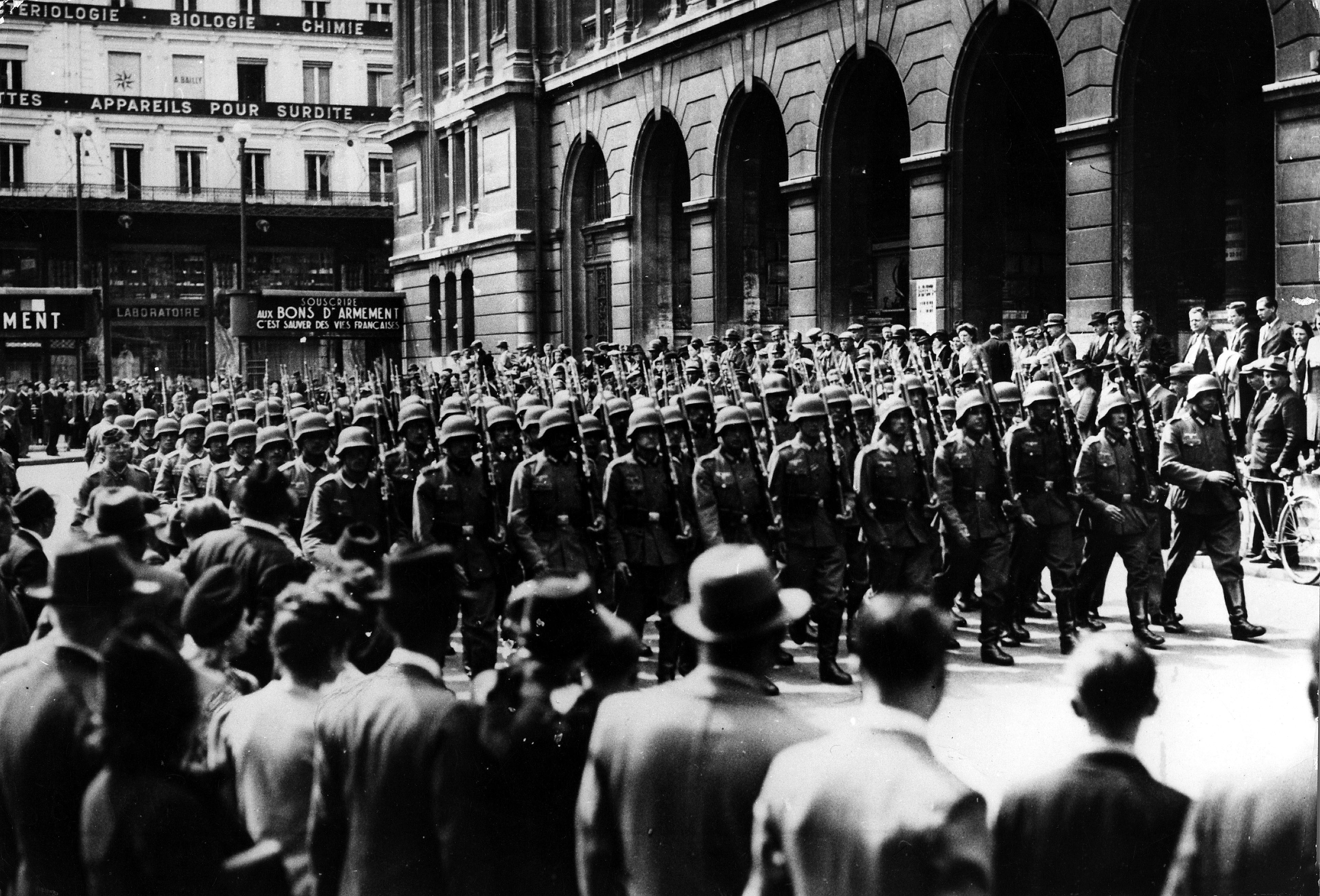 Slide 12 de 100: World War II, France - German watch column in Paris- 1940s