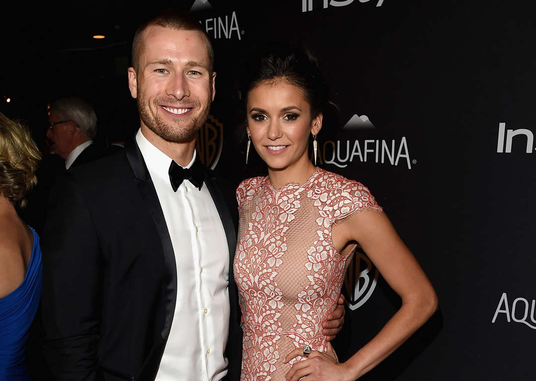 Slide 22 of 60: Actors Glen Powell (L) and Nina Dobrev attend The 2016 InStyle And Warner Bros. 73rd Annual Golden Globe Awards Post-Party at The Beverly Hilton Hotel on January 10, 2016 in Beverly Hills, California.