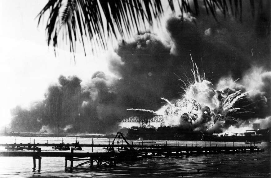 Slide 90 of 100: The American destroyer USS Shaw explodes during the Japanese attack on Pearl Harbour (Pearl Harbor), home of the American Pacific Fleet during World War II. (Photo by Keystone/Getty Images)