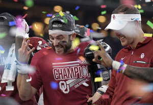 Oklahoma Sooners quarterback Baker Mayfield (6) and head coach Lincoln Riley on the award platform for the Big 12 Champion trophy after the game as Oklahoma beat TCU 41-17 in the Big 12 Football Championship game at AT&T Stadium Saturday, Dec. 2, 2017 in Arlington, Texas. (Max Faulkner/Fort Worth Star-Telegram/TNS via Getty Images)