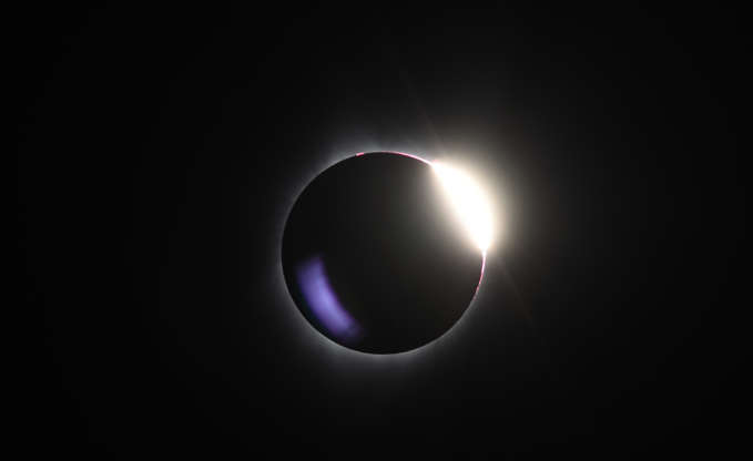 Slide 9 of 86: The diamond ring effect is visible as the moon passes in front of the sun during a total solar eclipse at Big Summit Prairie ranch in Oregon's Ochoco National Forest near the city of Mitchell on August 21, 2017.