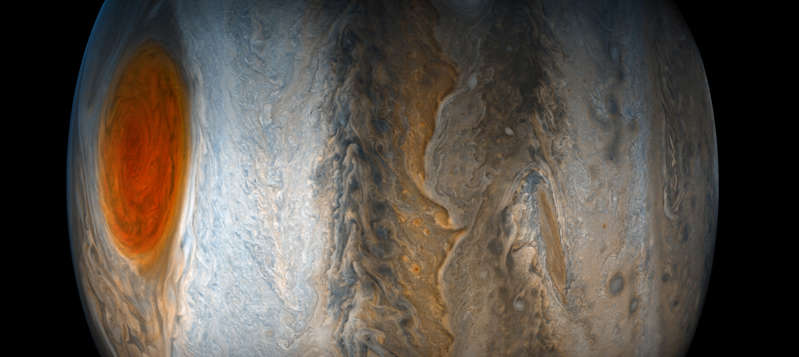 Slide 15 of 86: Jupiter's Great Red Spot fades from view while the dynamic bands of the southern region of Jupiter come into focus, in this image taken on July 10 from the JunoCam imager on NASA's Juno spacecraft. North is to the left of the image, and south is on the right.