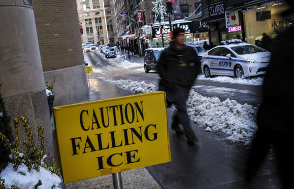 Slide 9 of 85: NEW YORK, NY - JANUARY 05: A sign warns pedestrians about falling ice in the Financial District, January 5, 2018 in New York City. Brutally cold temperatures and wind chills are expected in the city today throughout the weekend.