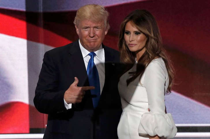 person wearing a suit and tie: Credits: REUTERS