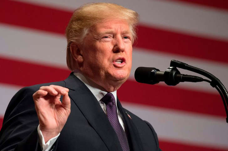 Donald Trump wearing a suit and tie: Credits: AFP