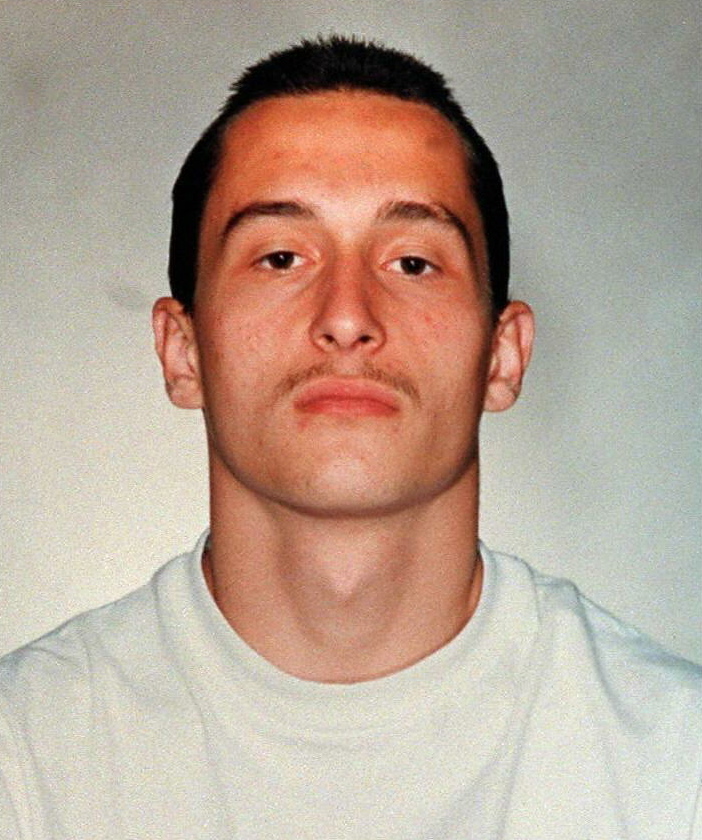 Slide 4 of 14: LOS ANGELES, UNITED STATES: This mugshot, released by the Los Angeles Police Deparment 13 March, is of Mikhail 'Michael' Markhasev,18, who has been charged with the murder of Ennis Cosby, the son of American entertainer Bill Cosby. Markhasev was born in Russia and is believed to be a member of a Russian car robbery team. (Photo credit should read MIKE NELSON/AFP/Getty Images)