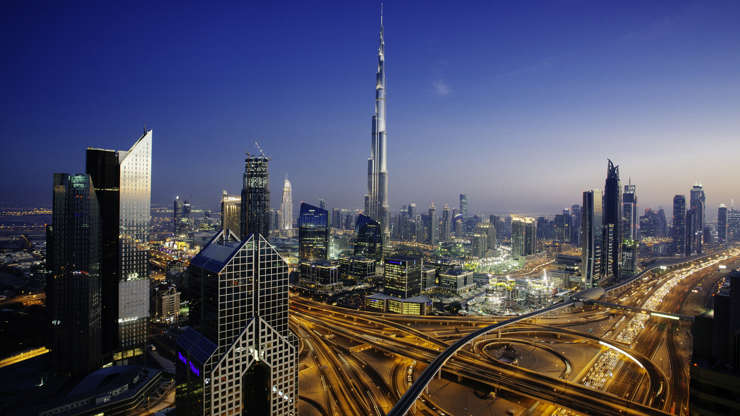 ÎÎ¹Î±ÏÎ¬Î½ÎµÎ¹Î± 31 Î±ÏÏ 51: Dusk view of awesome Dubai's sky line, Aerial view of the city at blue hour.