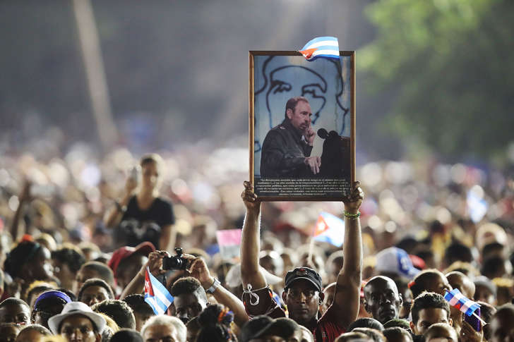 SANTIAGO DE CUBA, CUBA - DECEMBER 03:  People listen as Cuban President Raul Castro speaks during a memorial tribute for his brother former President of Cuba Fidel Castro at the Antonio Maceo Revoloution Square before his burial tomorow on December 3, 2016 in Santiago de Cuba, Cuba. Mr. Castro died on November 25th at the age of 90 and the country is in the midst of a 9 day mourning period that lasts until his funeral on Sunday in Santiago de Cuba at the CementerioÊSanta Ifigenia.  (Photo by Joe Raedle/Getty Images)