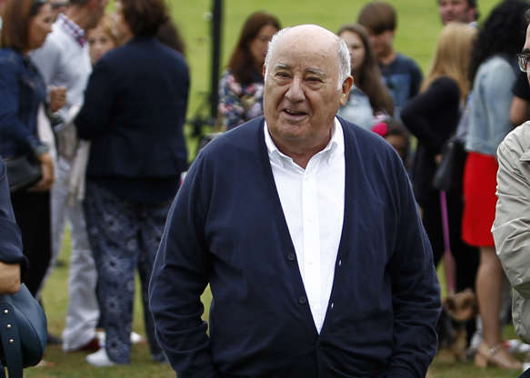 Slide 19 of 20: In this July 30, 2016 photo, Amancio Ortega Gaona, founding shareholder of Inditex fashion group, best known for its chain of Zara clothing and accessories retail shops, walks during the Casas Novas International Jumping Show in Arteixo, A Coruña, in the Galicia region of northwest Spain. Amancio Ortega, has been named as the richest person in Europe, and the second richest in the whole world. (AP Photo/Iago Lopez)