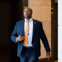 Sen. Tim Scott, R-S.C., leaves a closed meeting in the Capitol on Russia sanctions on Tuesday, July 31, 2018.