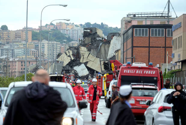 Slide 4 de 20: A picture taken on August 14, 2018 in Genoa shows a section of a giant motorway bridge that collapsed earlier injuring several people.