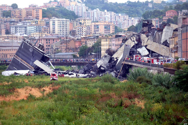 Slide 8 de 20: A picture taken on August 14, 2018 in Genoa shows a section of a giant motorway bridge that collapsed earlier injuring several people.