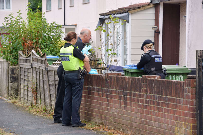 Police officers search the family home on Mansel Road East, Southampton, of Stephen Nicholson, who has been arrested on suspicion of murder and sexual activity with a child
