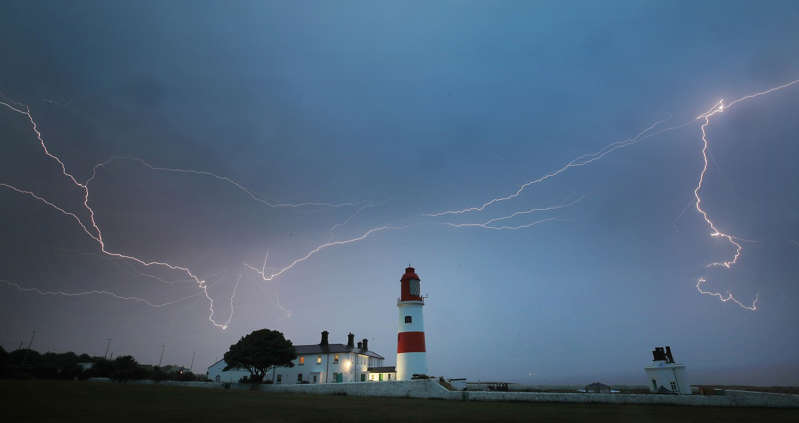 Lightning flashes over Souter lighthouse in South Shields as heavy thunderstorms marked the end of the UK heatwave on Friday.