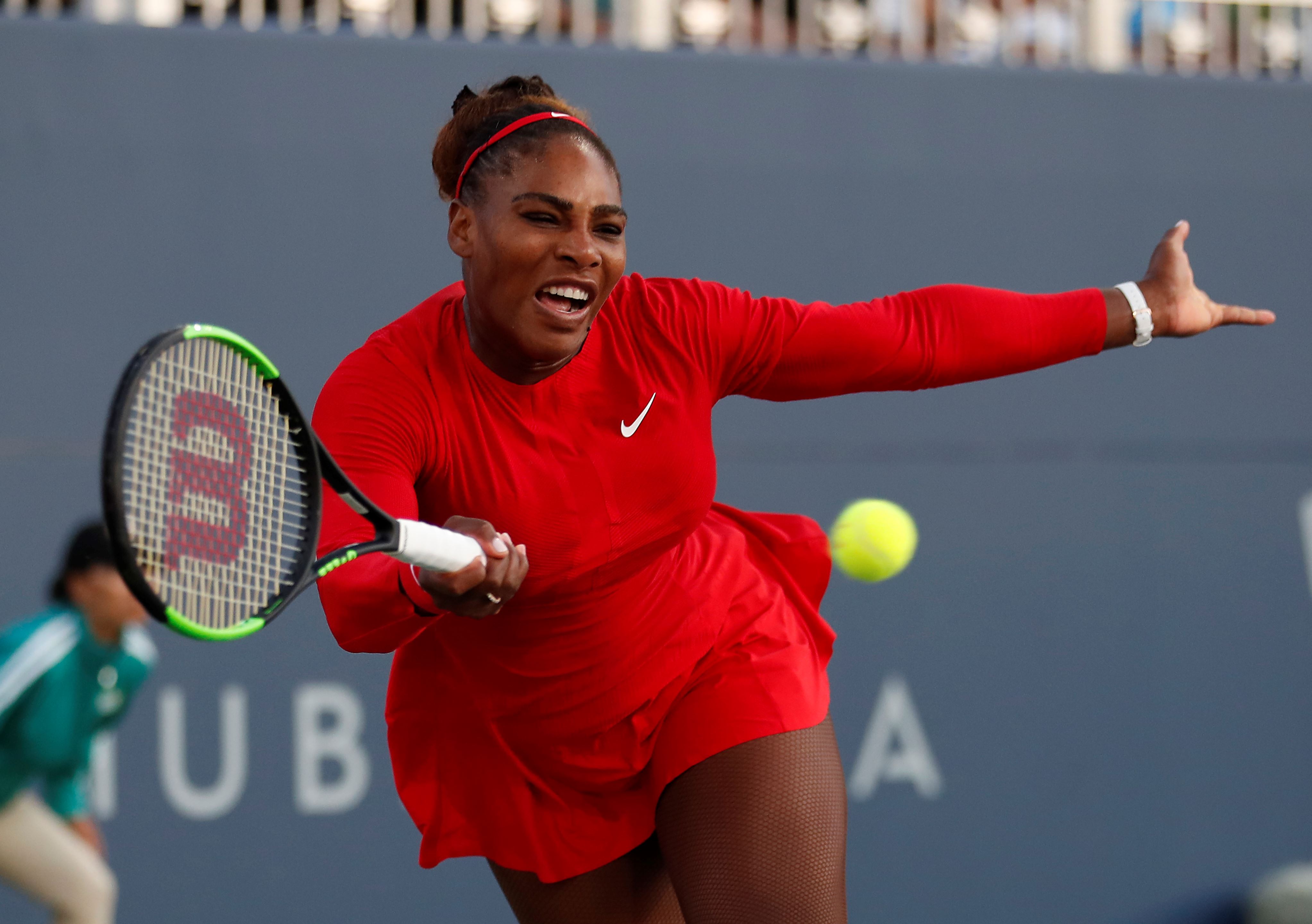 Serena Williams, of the United States, returns the ball to Johanna Konta, from Britain, during the Mubadala Silicon Valley Classic tennis tournament in San Jose, Calif., Tuesday, July 31, 2018. Konta won 6-1, 6-0.