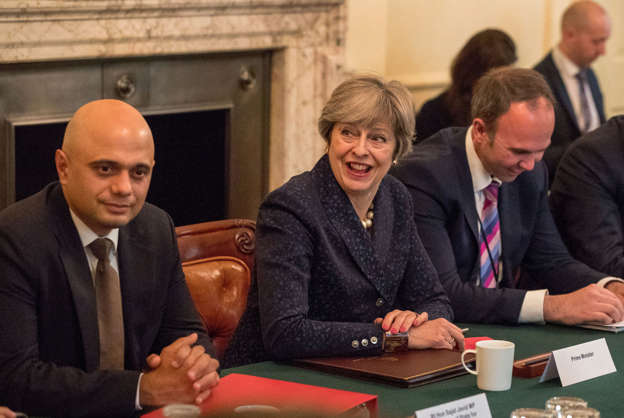 Britain's Prime Minister Theresa May, (C), with Britain's Communities and Local Government Secretary Sajid Javid (L) and Chief of Staff Gavin Barwell, hosts a roundtable meeting about housing supply at 10 Downing Street in central London on October 17, 2017.  / AFP PHOTO / POOL / Steve Parsons        (Photo credit should read STEVE PARSONS/AFP/Getty Images)