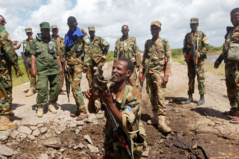 Somali soldiers stand at a Somali military base, near the site of the attack in a file photo