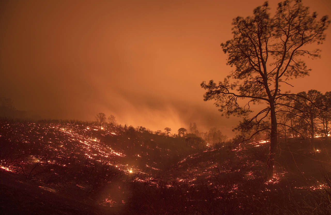 Slide 1 of 95: A hillside smolders after flames passed through during the Ranch Fire in Clearlake Oaks, Calif., on Sunday, Aug. 5, 2018.