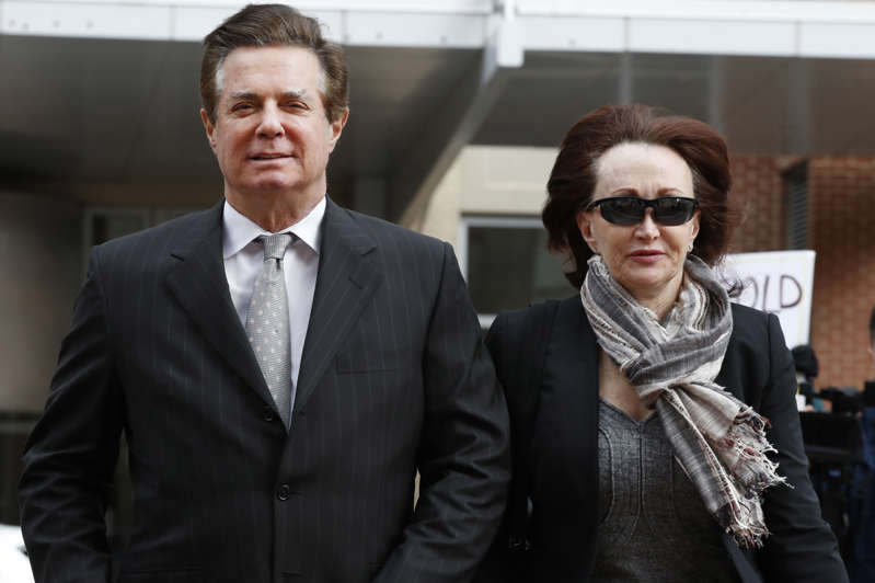 FILE - In this March 8, 2018, file photo, Paul Manafort, left, President Donald Trump's former campaign chairman, walks with this wife Kathleen Manafort, as they arrive at the Alexandria Federal Courthouse in Alexandria, Va. The special counsel’s office says it plans to call 35 witnesses in the upcoming trial of Manafort. (AP Photo/Jacquelyn Martin, File)