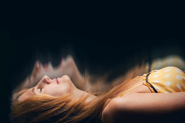 Diapositiva 11 de 34: A concept image of a sleeping woman having a nightmare.