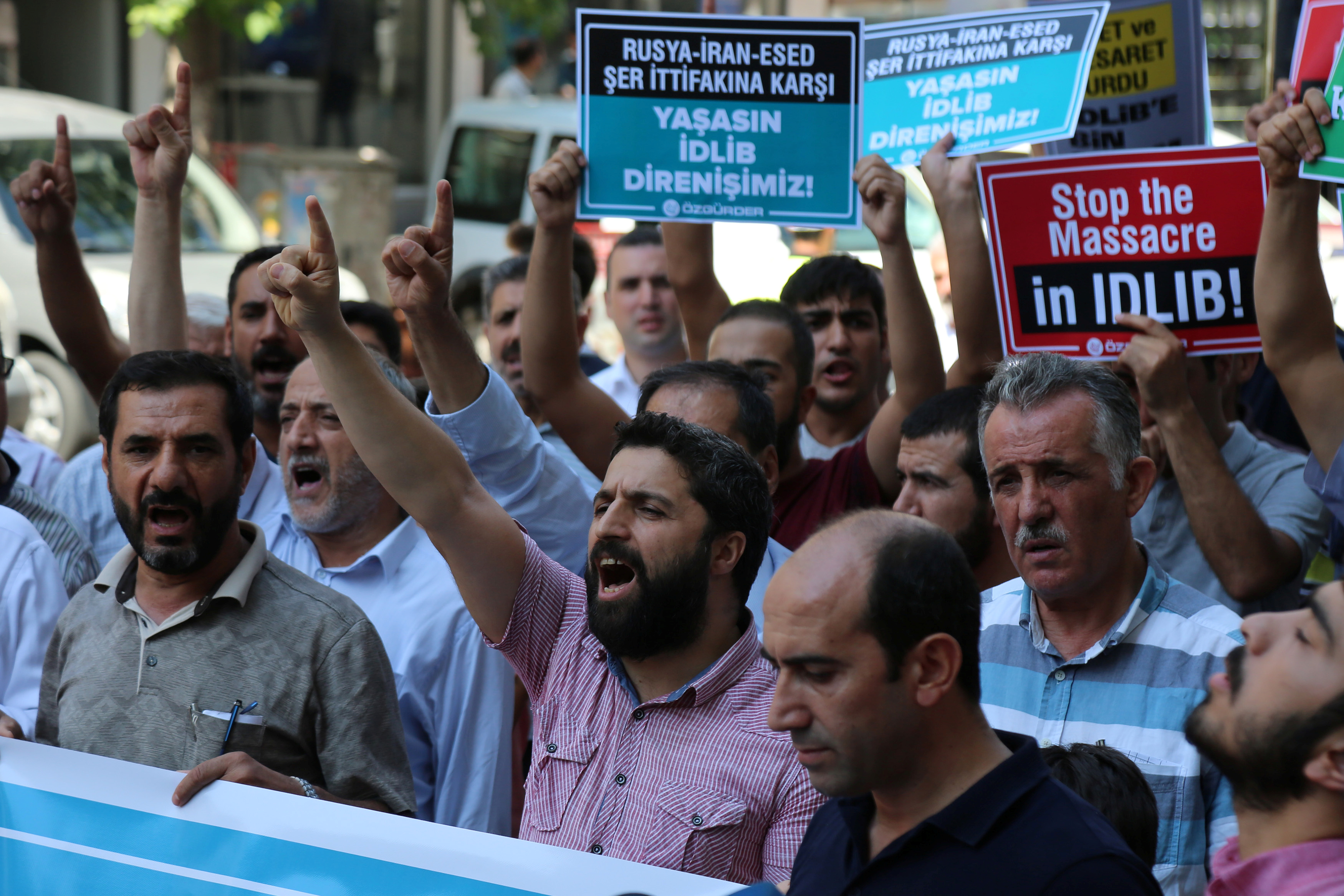 Demonstrators shout slogans during a protest against a Syrian military operation in the rebel-held Idlib province of northwest Syria, in Diyarbakir, Turkey September 7, 2018. REUTERS/Sertac Kayar