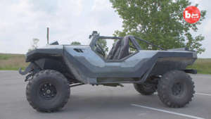 a tractor in front of a car: Halo Warthog Replica
