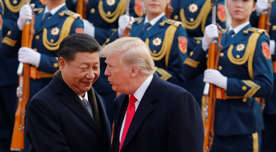 U.S. President Donald Trump, right, chats with Chinese President Xi Jinping during a welcome ceremony at the Great Hall of the People in Beijing, Thursday, Nov. 9, 2017. (AP Photo/Andy Wong)