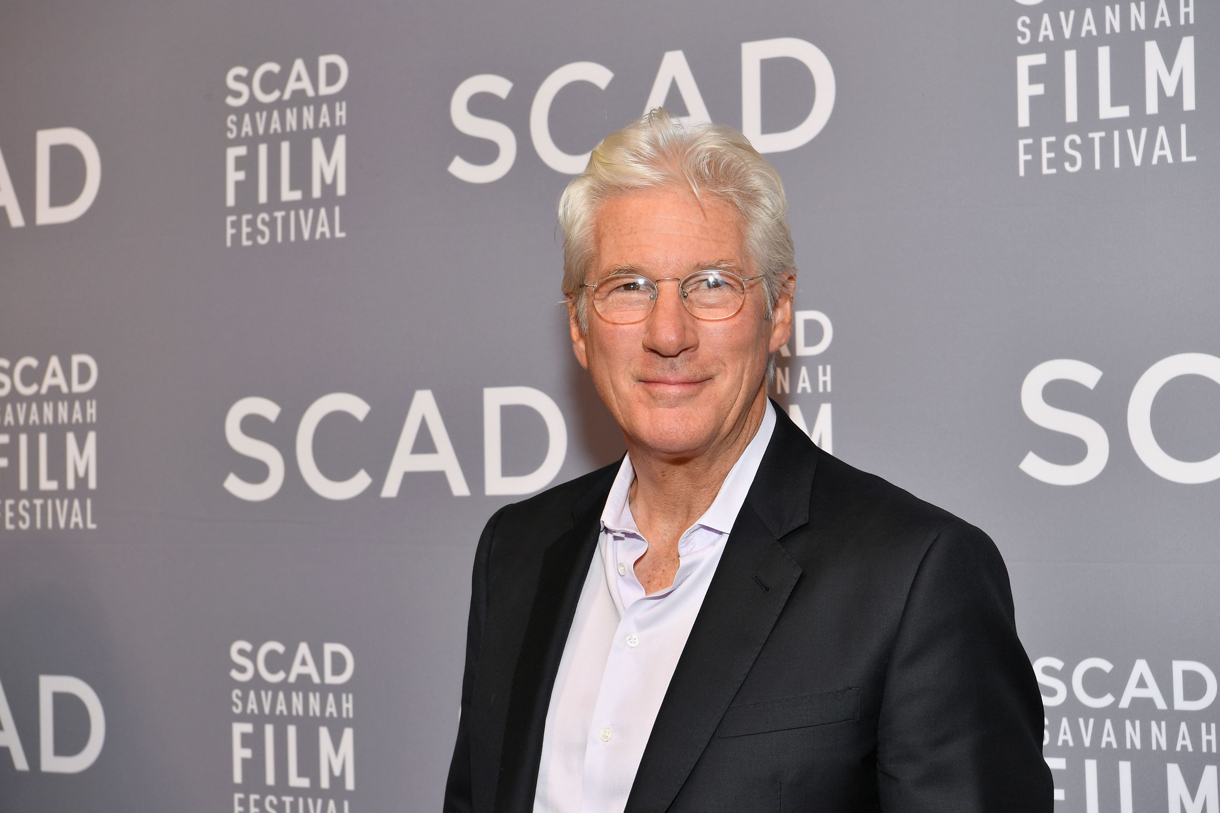 Slide 24 of 60: Raised Catholic, Gere later became a Buddhist.