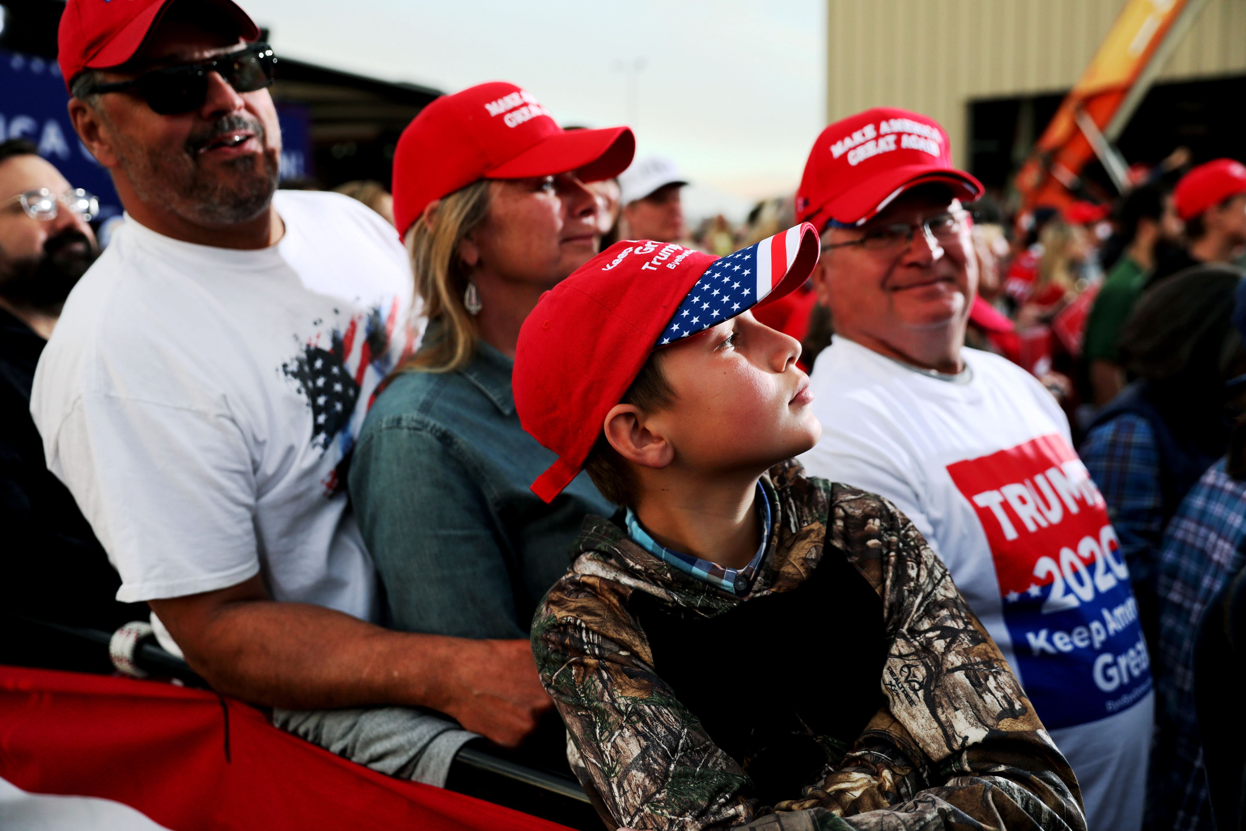 Supporters stand during a rally for President Donald Trump at Missoula International Airport in Missoula, Montana, Oct. 18, 2018.