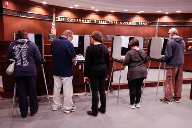 Slide 2 of 15: Voters cast their ballots early for the midterm elections at the Government & Judicial Center in Noblesville, Ind., Tuesday, Oct. 23, 2018. (AP Photo/Michael Conroy)