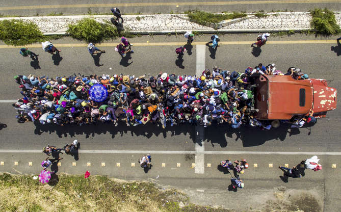 Chiapas state, Mexico - Pedro Pardo/AFP/Getty Images Slide 25 of 39: Aerial view of Honduran migrants onboard a truck as they take part in a caravan heading to the US, in the outskirts of Tapachula, on their way to Huixtla, Chiapas state, Mexico, on Oct. 22. - President Donald Trump on Monday called the migrant caravan heading toward the US-Mexico border a national emergency, saying he has alerted the US border patrol and military.