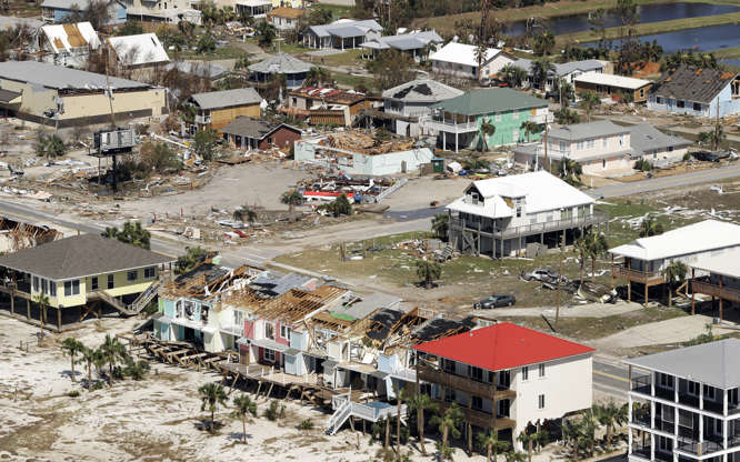 Slide 1 of 80: Homes destroyed by Hurricane Michael are shown from the air October 11, 2018 in Mexico Beach, Florida.