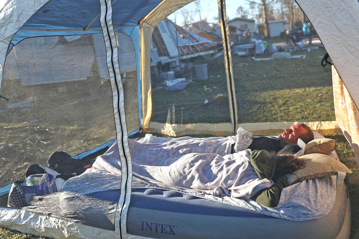 Slide 3 of 92: Cory Hight and Chasity Andrews sleep together outside their home that was  destroyed by Hurricane Michael when it passed through the area, October 13, 2018 in Panama City, Florida. The hurricane hit the Florida Panhandle as a category 4 storm causing massive damage and claimed the lives of 17 people. (Photo by Joe Raedle/Getty Images)