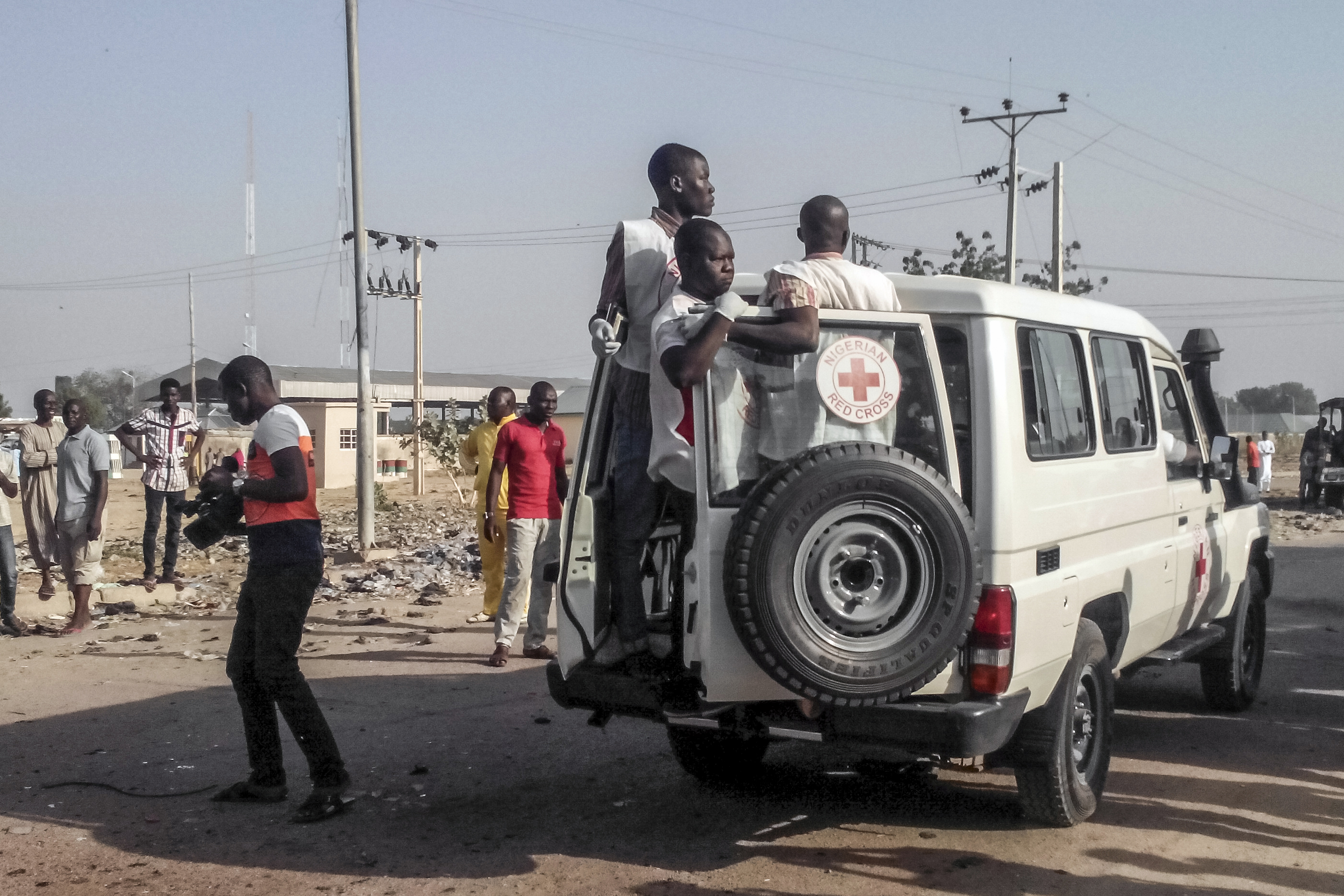 FILE - Nigerian Red Cross personnel drive away the remains of victims of two suicide bombings in Nigeria's northeast city of Maiduguri on October 29, 2016 where at least nine people were killed and scores of others were injured.