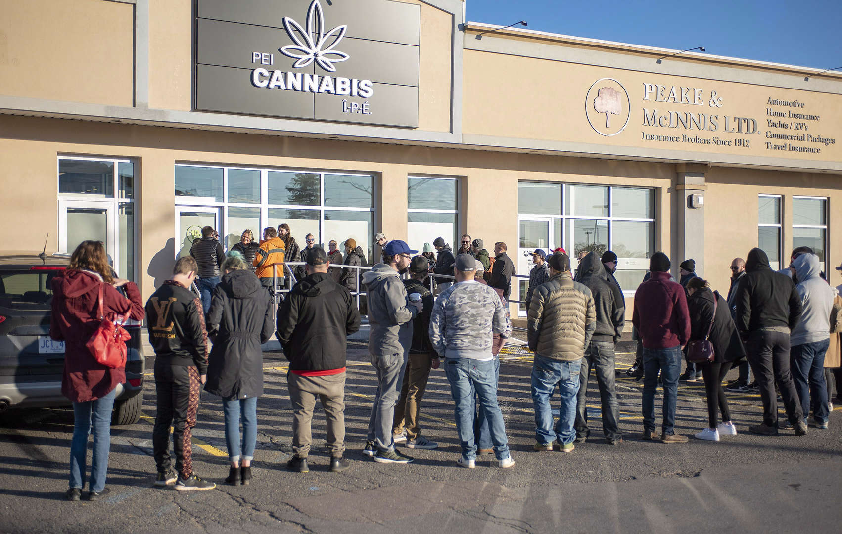 Customers line up at the retail cannabis store in Charlottetown, P.E.I., Wednesday October 17, 2018. - THE CANADIAN PRESS/Brian McInnis Slide 4 of 31: Customers line up at the retail cannabis store in Charlottetown, P.E.I., Wednesday October 17, 2018.