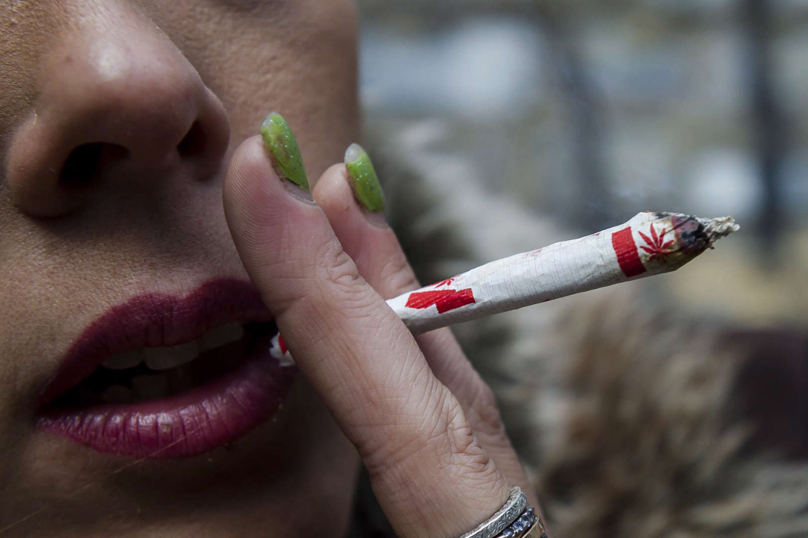 Krissy Calkins smokes a marijuana joint at a "Wake and Bake" legalized marijuana event in Toronto on... - THE CANADIAN PRESS/Christopher Katsarov Slide 11 of 31: Krissy Calkins smokes a marijuana joint at a "Wake and Bake" legalized marijuana event in Toronto on Wednesday, October 17, 2018.