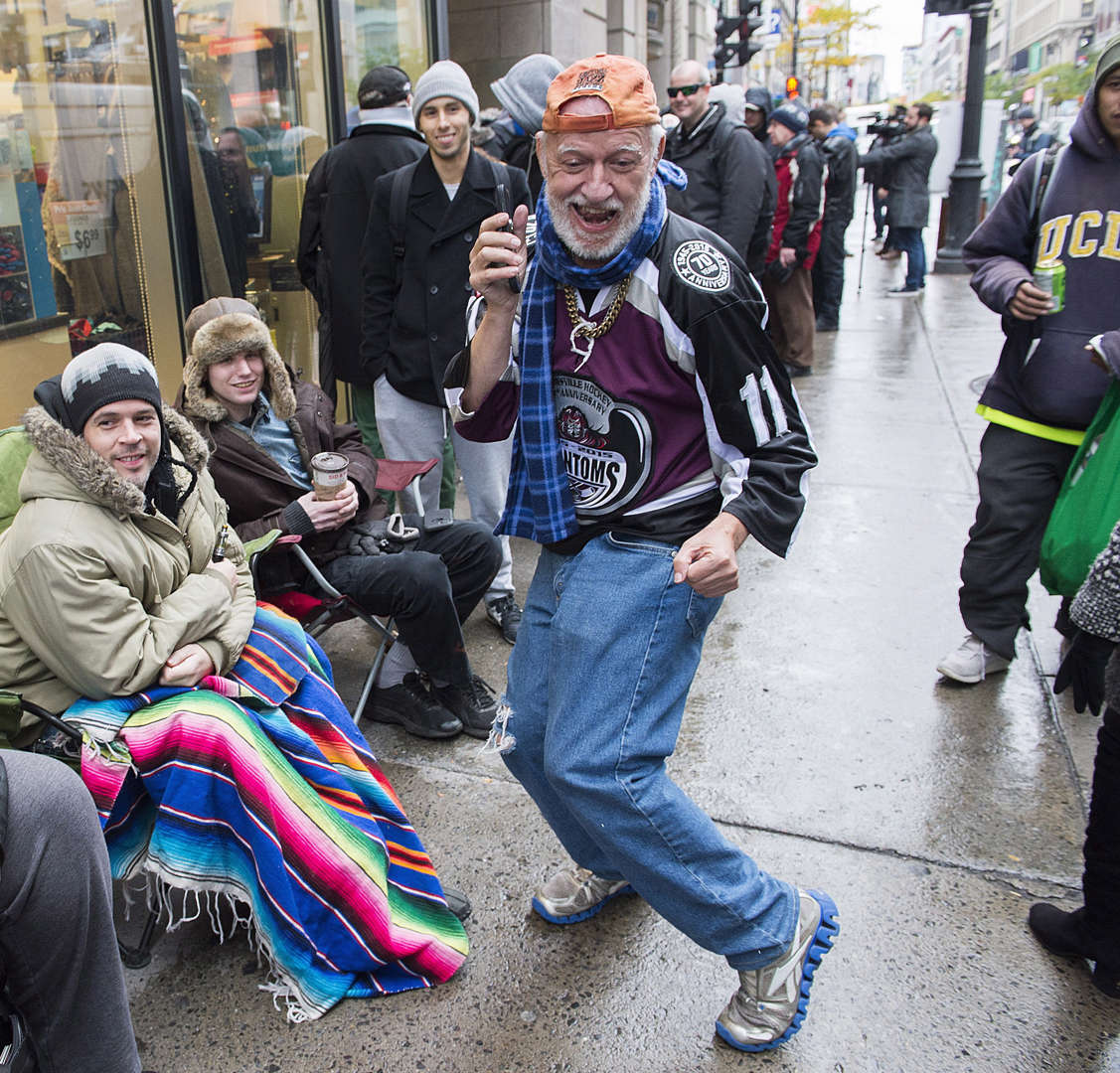 A man dances as he waits in line to purchase legal cannabis outside a government cannabis store in M... - THE CANADIAN PRESS/Graham Hughes Slide 12 of 31: A man dances as he waits in line to purchase legal cannabis outside a government cannabis store in Montreal, Wednesday, October 17, 2018.