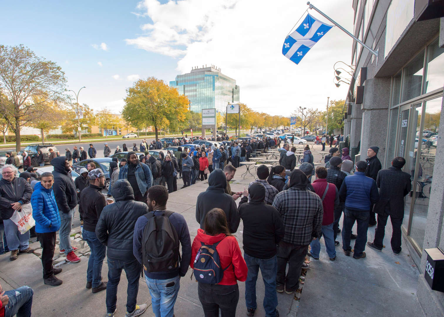Hundreds of people line up at a government cannabis store Wednesday, October 17, 2018 in Montreal as... - THE CANADIAN PRESS/Ryan Remiorz Slide 19 of 31: Hundreds of people line up at a government cannabis store Wednesday, October 17, 2018 in Montreal as the legal sale of cannabis begins in Canada.