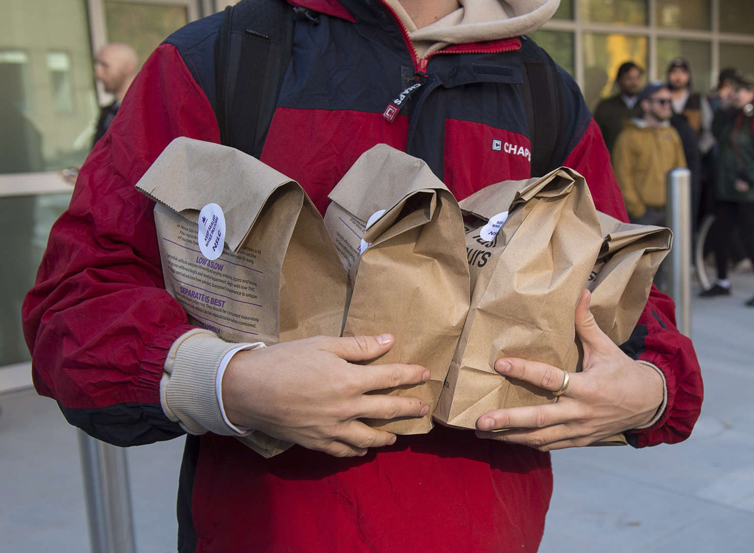 A customer carries his purchases as he leaves the Nova Scotia Liquor Corporation cannabis store in H... - THE CANADIAN PRESS/Andrew Vaughan Slide 1 of 31: A customer carries his purchases as he leaves the Nova Scotia Liquor Corporation cannabis store in Halifax on Oct. 17, 2018.