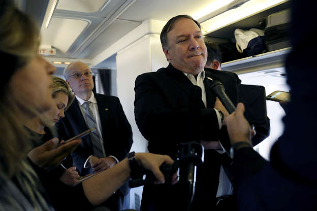 Slide 4 of 38: U.S. Secretary of State Mike Pompeo speaks to reporters while his plane refuels in Brussels, Belgium October 17, 2018.