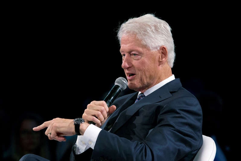 Former U.S. President Bill Clinton speaks at the Bloomberg Global Business Forum, Wednesday, Sept. 26, 2018, in New York. (AP Photo/Mark Lennihan)